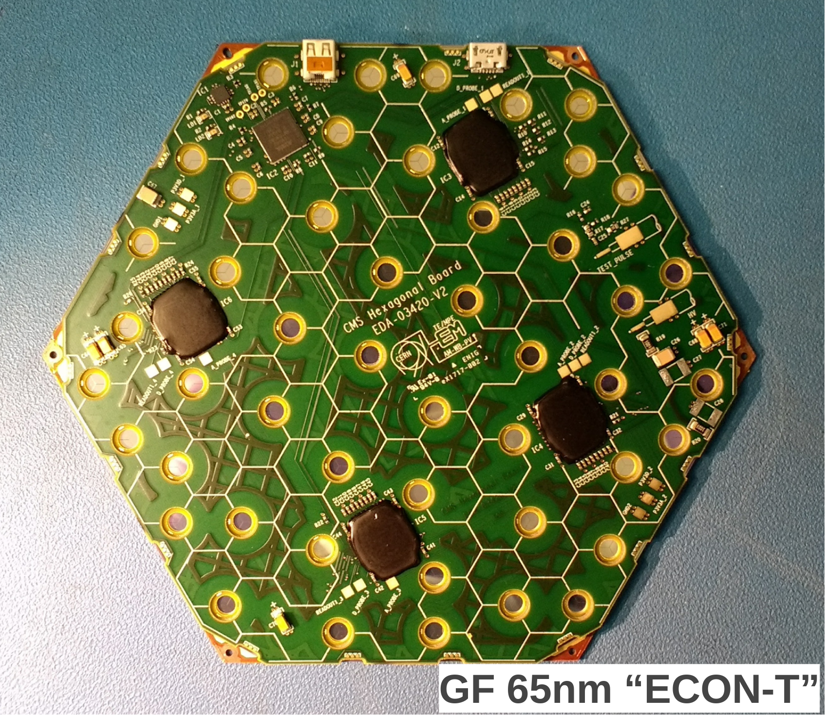 Reconfigurable Neural Network ASIC for Detector Front-End Data Compression at the HL-LHC